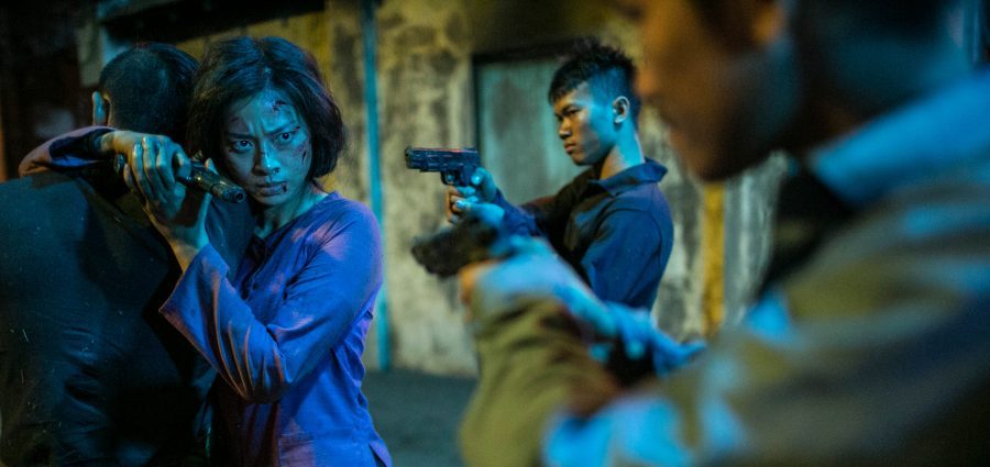 Veronica Ngo pointing gun to hunchmen in Vietnam film - FURIE