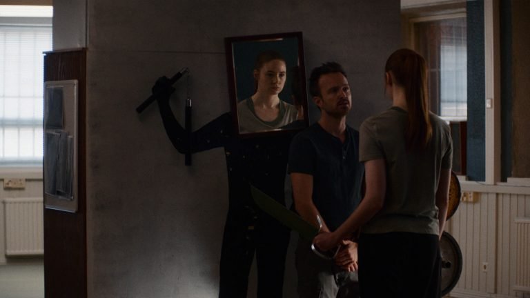 Dual [2022]: ‘Sundance’ Review – A pitch-black dark comedy where capitalism is the killer