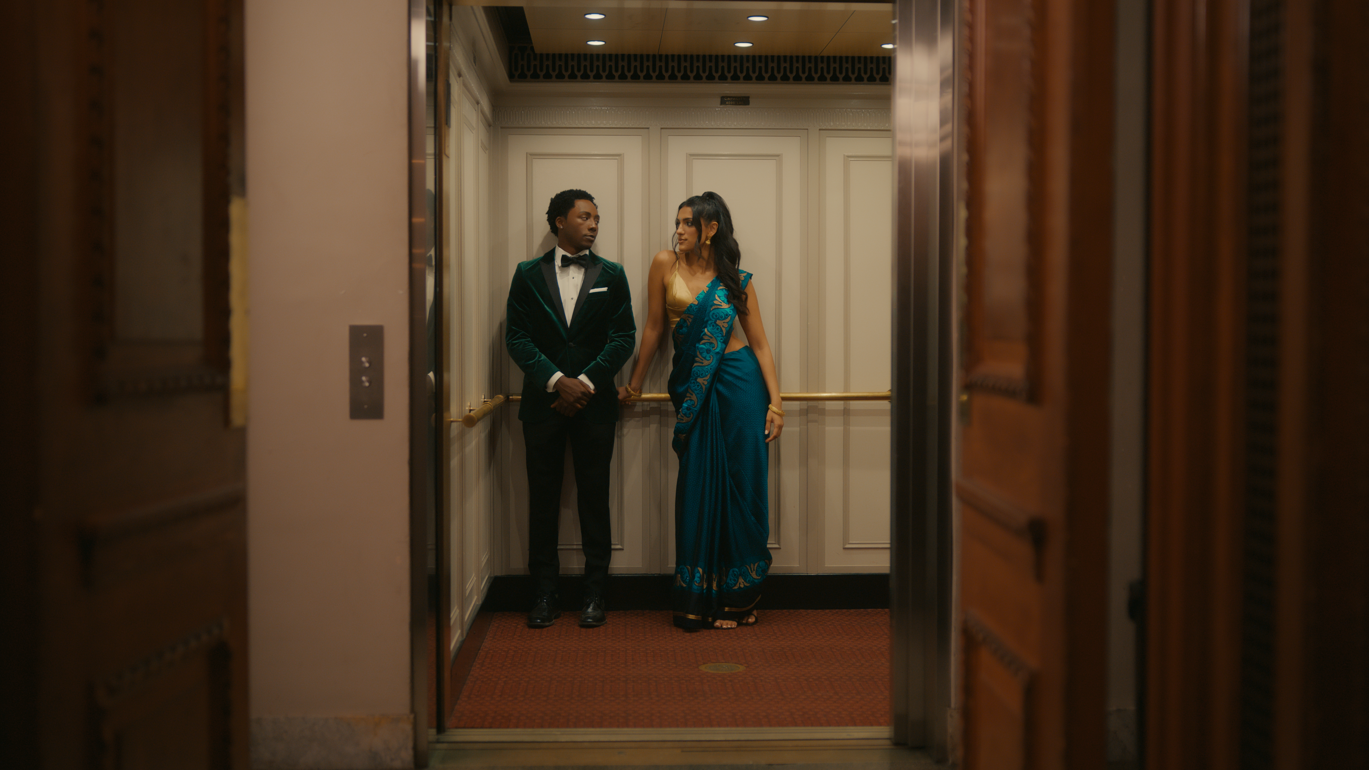 Laquan Copeland as Ricky Pryce and Herkamal Preet Kaur as Sunita Gia Arora in Midas (2024). 