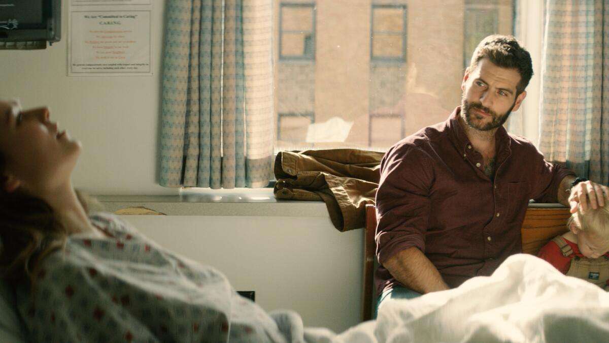 (L-R)- Alan Powell (right) in a scene from "Shooting Heroin." 