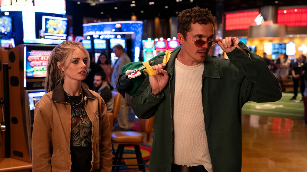 Samara Weaving as Edie & Karl Glusman as John in Eenie Meanie (2025). 