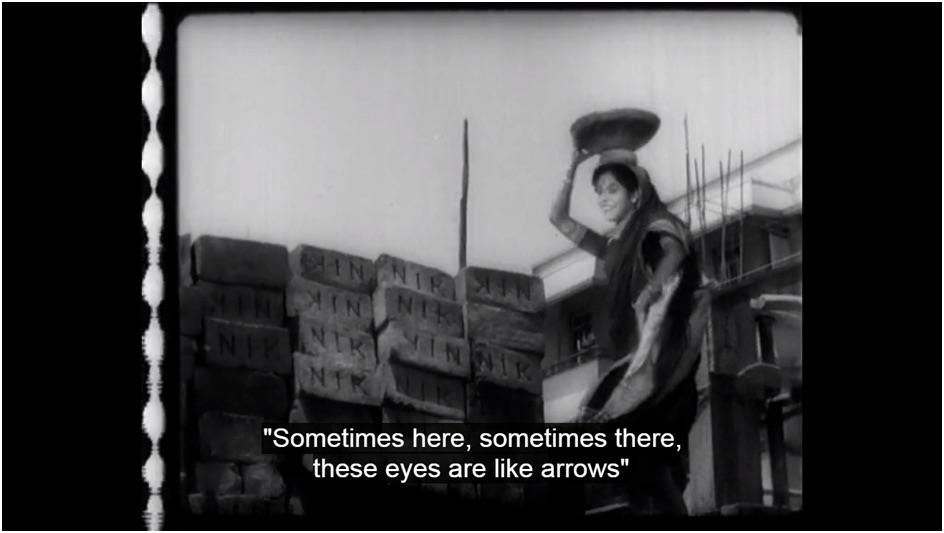 The woman worker at the construction site singing Kabhi Aar Kabhi Paar 