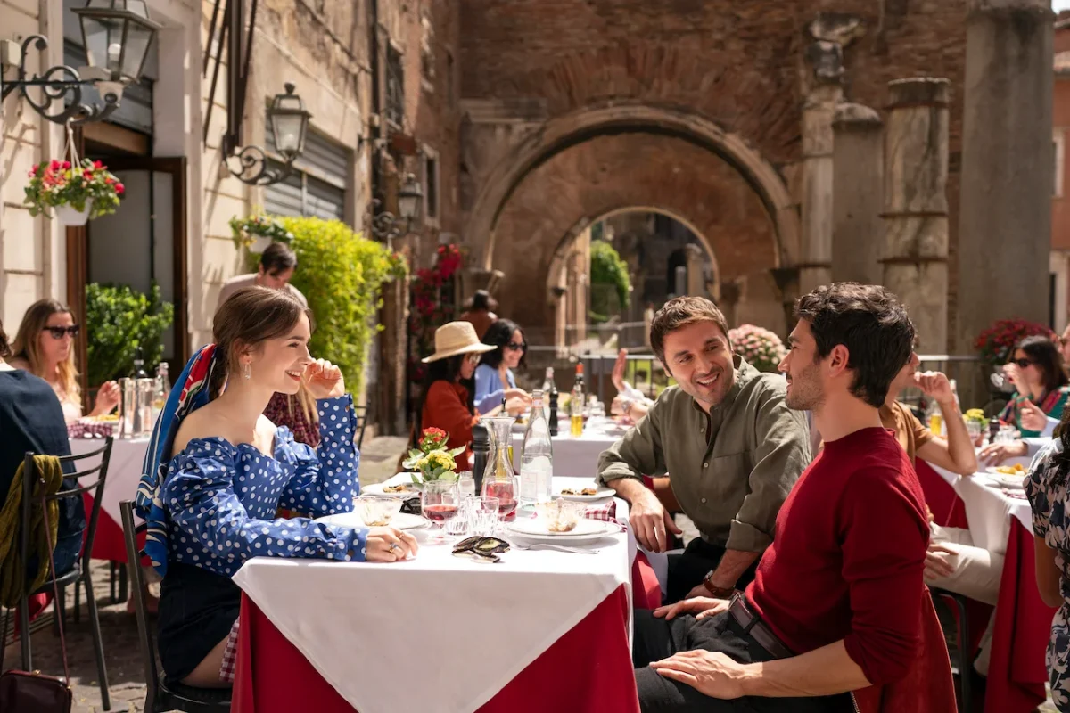 Emily In Paris. (L To R) Lily Collins As Emily, Flavio Furno As Gianni, Eugenio Franceschini As Marcello In Emily In Paris. Cr. Giulia Parmigiani/netflix © 2024
