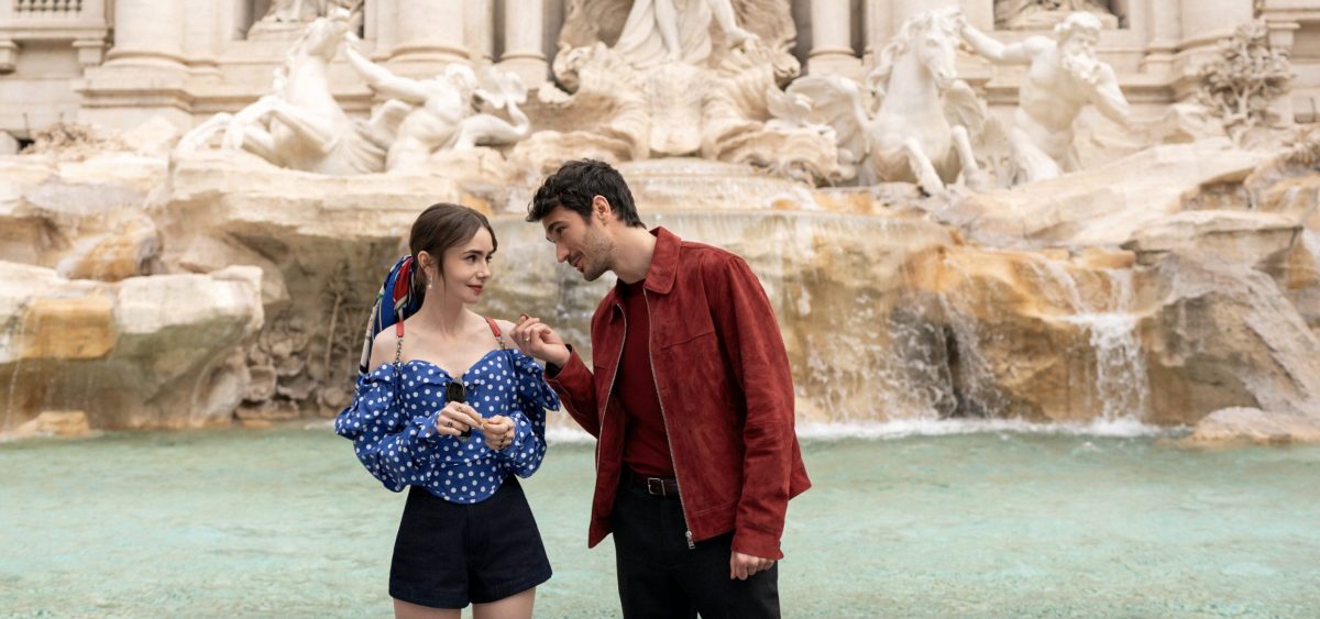 Lily Collins as Emily, Eugenio Franceschini as Marcello at Trevi Fountain in Emily in Paris